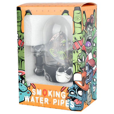 Zombie Head Bell Jar Water Pipe - 4.75" / 14mm F in decorative packaging with colorful zombie illustrations